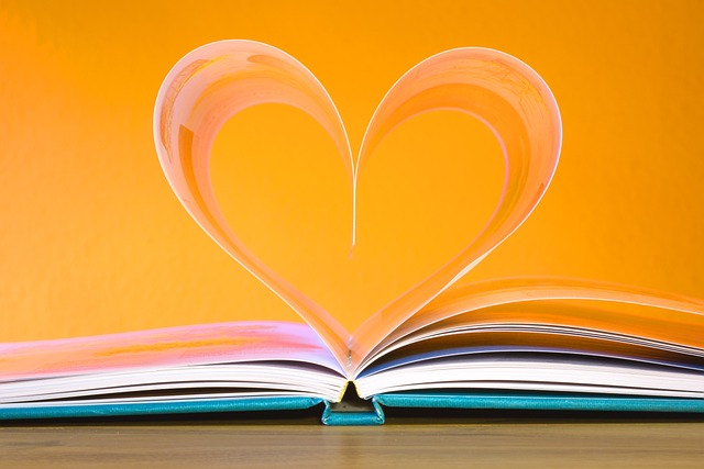 book with pages curled into a heart