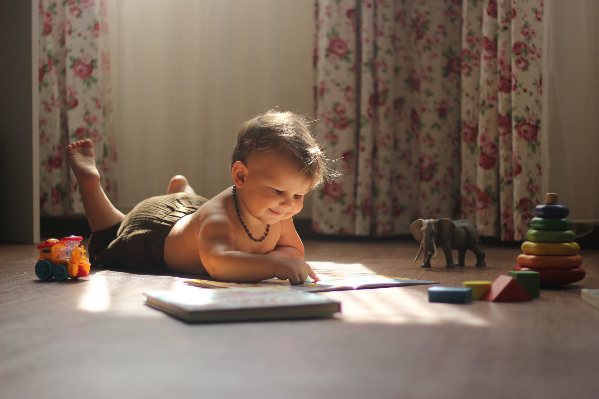 young child reading book