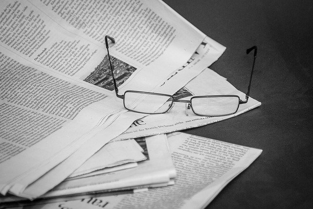 newspapers with glasses