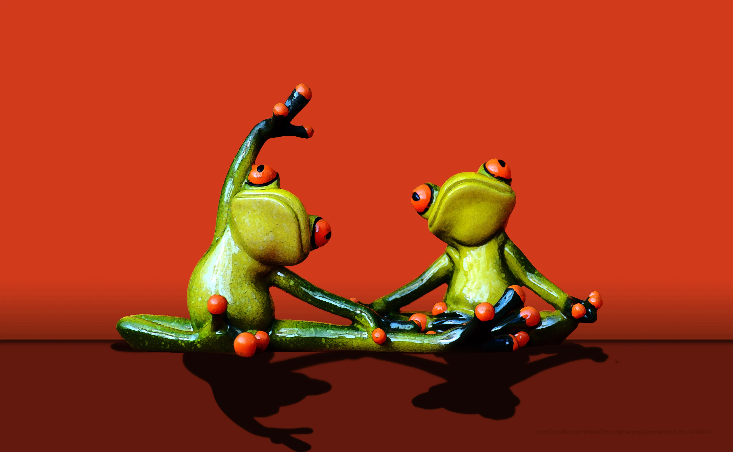 frog figurines doing yoga