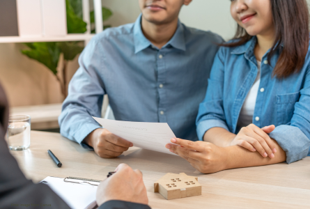 a couple looking at a contract