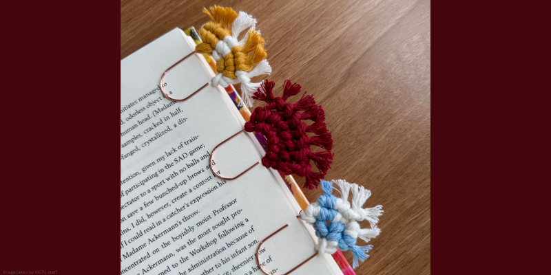 macrame bookmarks clipped to a book