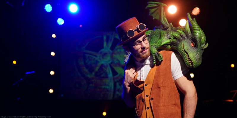 performer brock barnabas with animatronic dragon on his shoulder