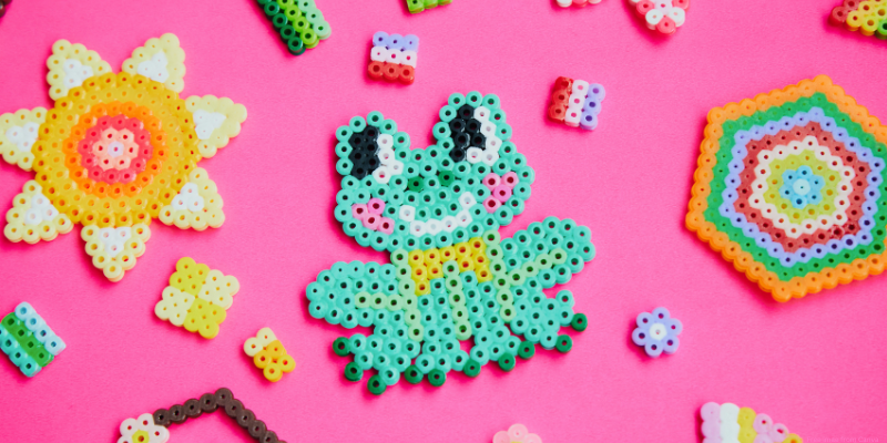 colorful perler bead designs of a flower and frog and small designs