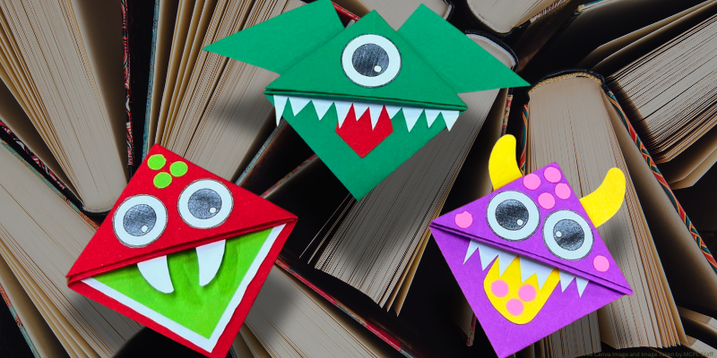 transparent background of book pages with three paper origami corner bookmarks with decorations