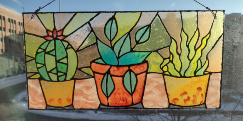 faux stained glass rectangle window hanging with three succulent plant designs
