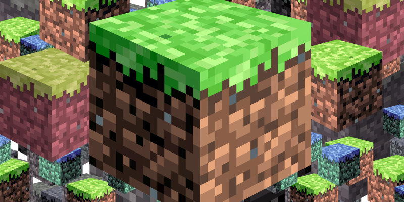 A large pixelated cube with a grass top surrounded by similar floating blocks in a video game style.