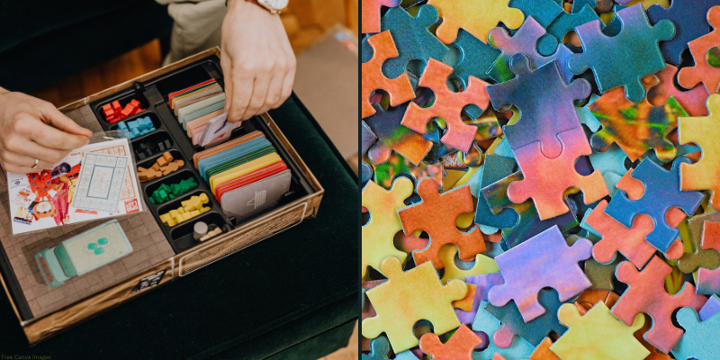 A board game box with organized components on the left and colorful jigsaw puzzle pieces on the right.