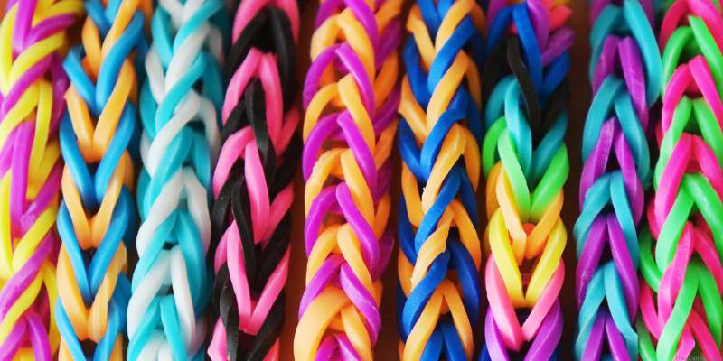 colorful mini rubber bands forming woven bracelets