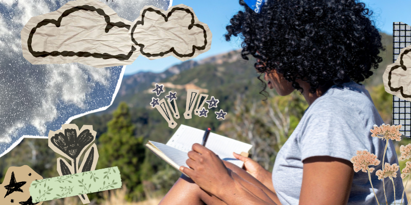 person sitting outside writing in a small notebook with scrapbook paper details